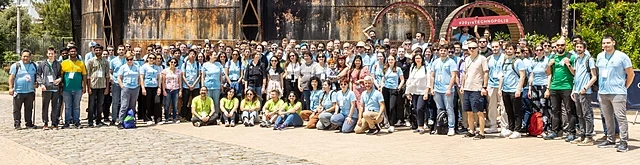 Group of Hackathon attendees standing outside in the blazing sun